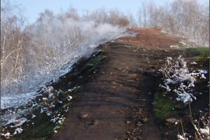 View of the Ema spoil heap with smoke emissions, without snow cover (10/2009)